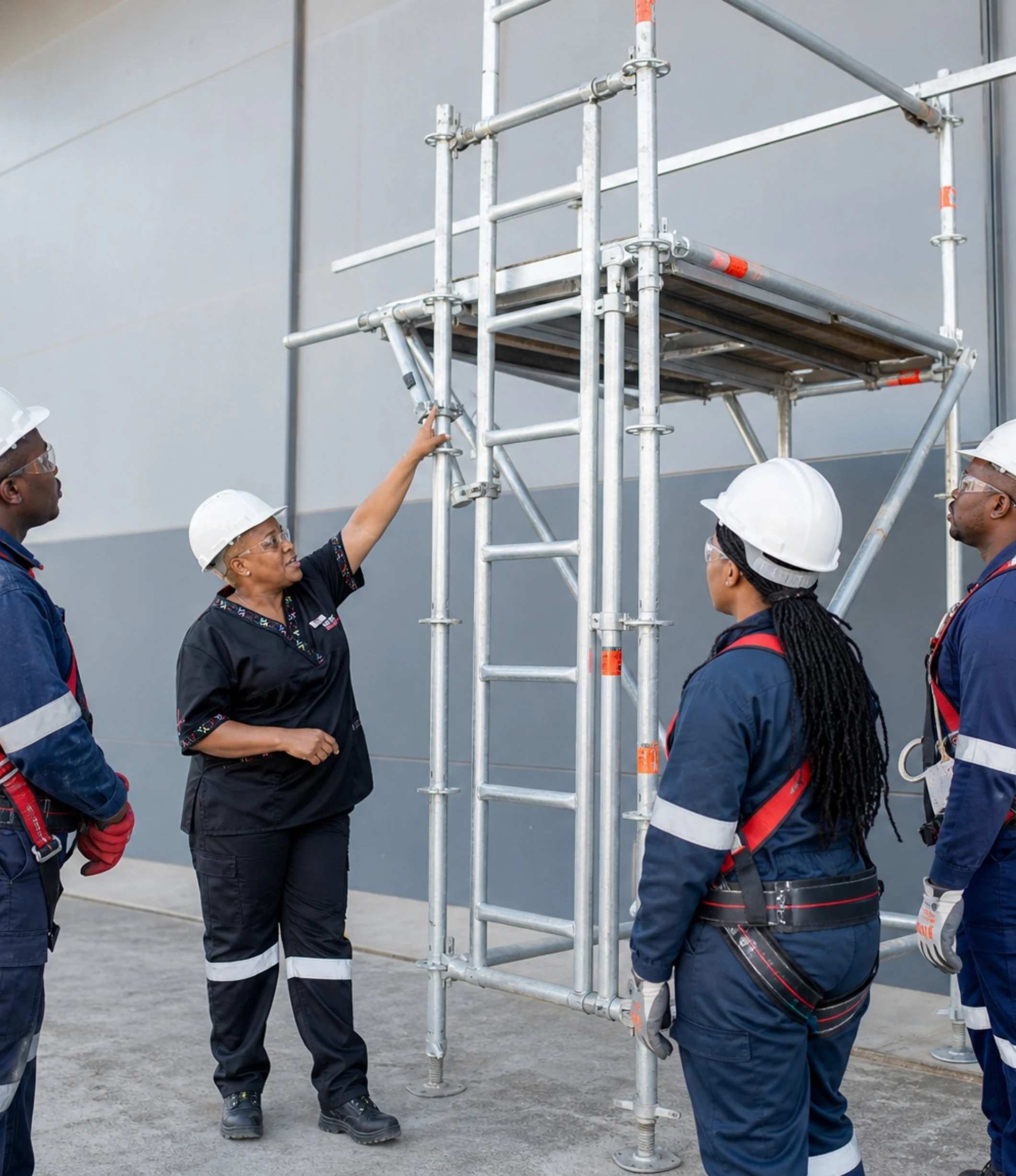 A Care Net health and safety training session in progress on the scaffold rig