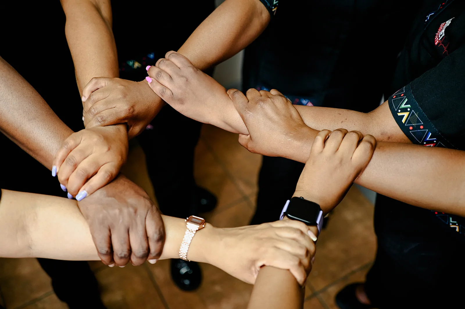 The Care Net Consultants team with their hands together