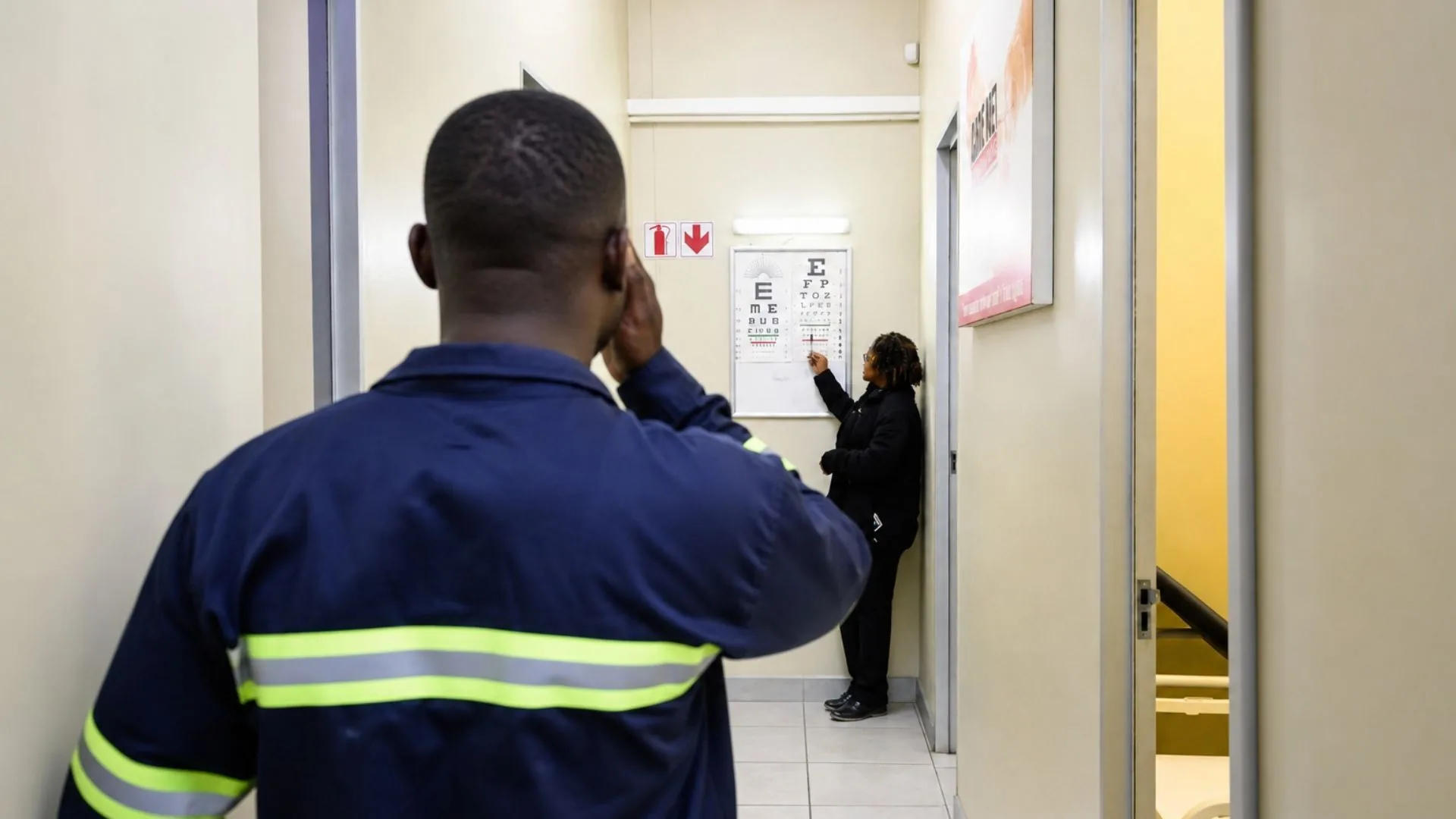 A worker completing a vision test at a Care Net clinic.